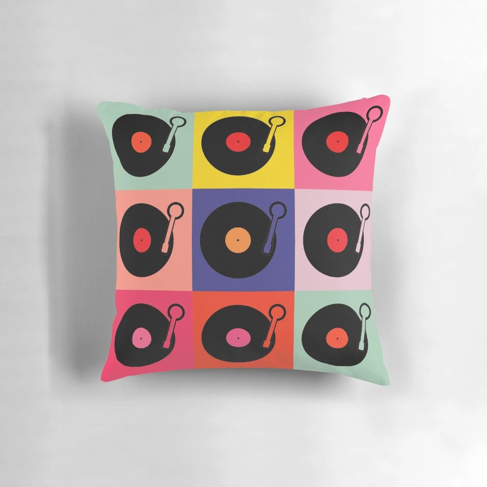 Colorful pop art collage of vintage vinyl records on a decorative throw pillow