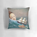 A surreal, fantasy-inspired pillow featuring a woman gazing out to sea, designed by artist Christian Schloe.