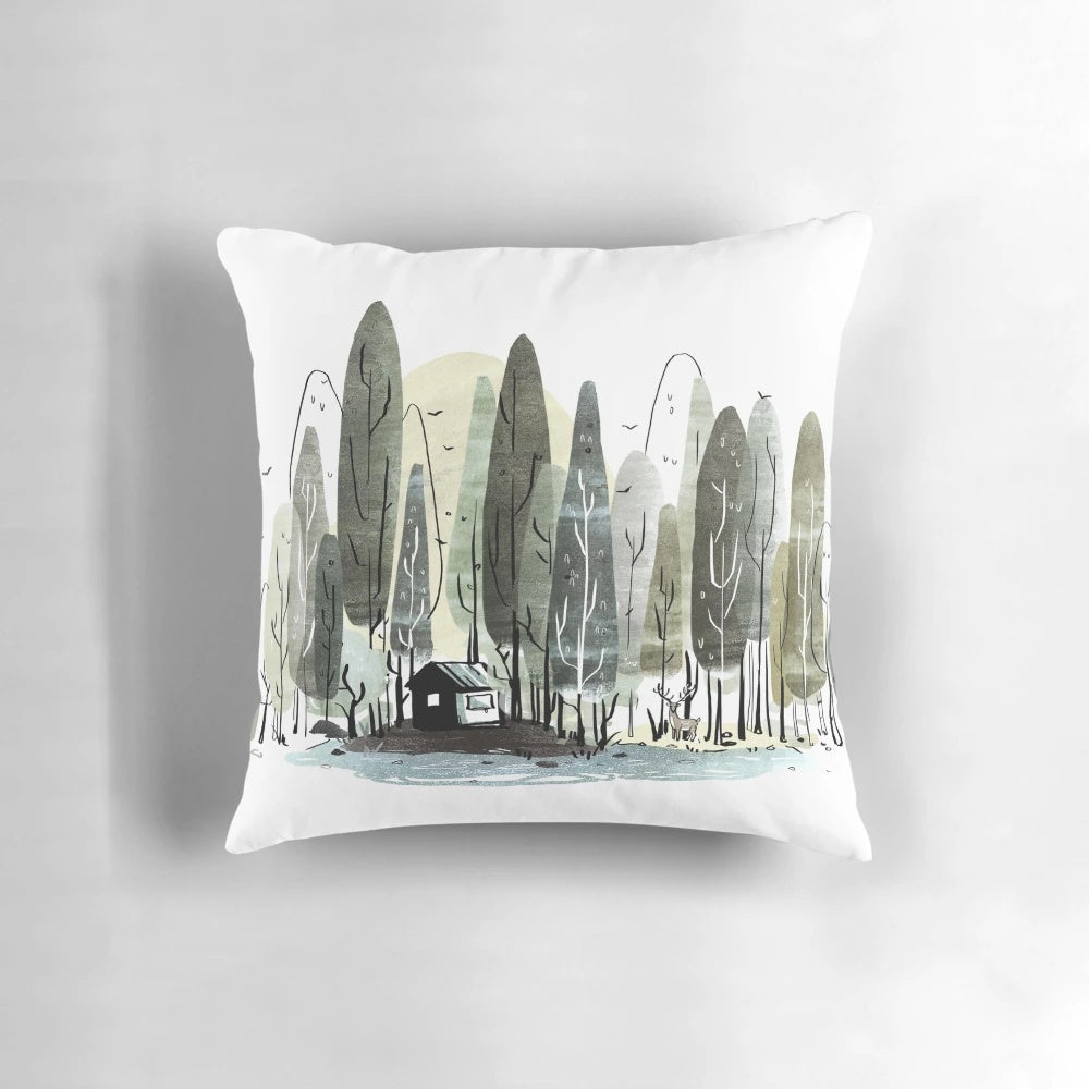 Walden-inspired pillow with nature motifs including forest, deer, and woods
