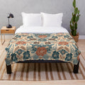 Soft and plush floral patterned blanket in shades of blue, brown, and rust