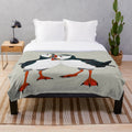 Warm grey plush blanket with a puffin bird design, perfect for nature lovers and cozy home decor.