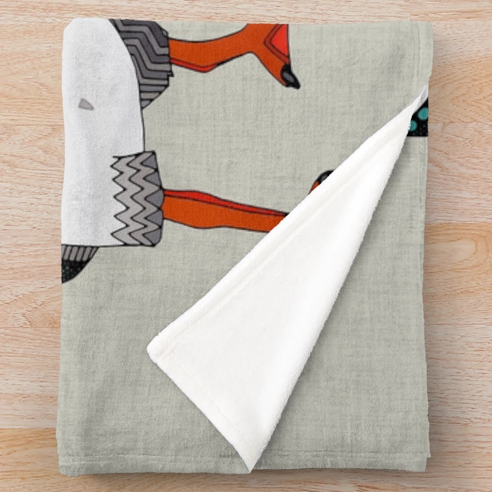 Warm grey plush blanket with a puffin bird design, perfect for nature lovers and cozy home decor.