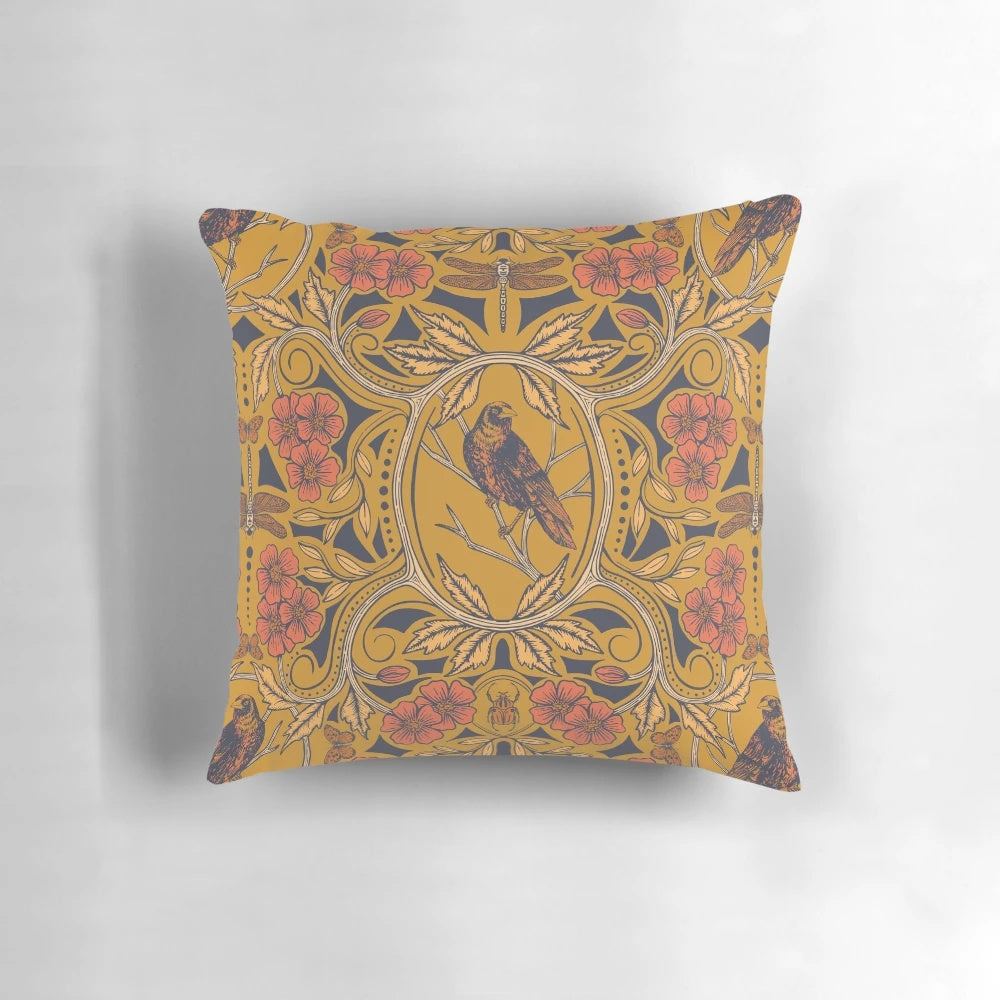 Warm mustard yellow and orange throw pillow with crow and dragonfly floral design in art nouveau botanical boho style