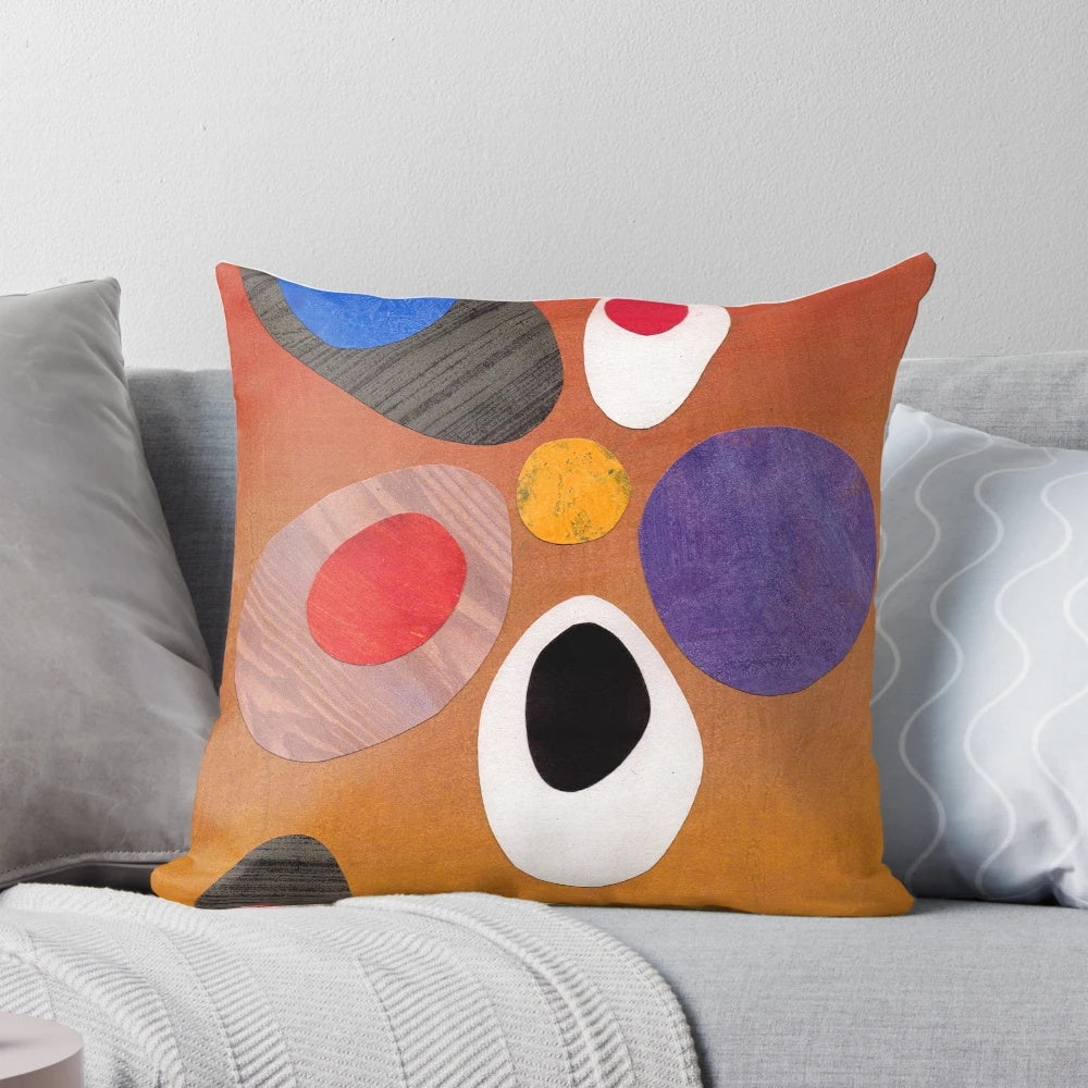 Warm, rich-colored abstract retro-style painting collage design on a throw pillow.