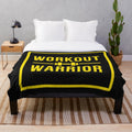 Warrior-inspired plush blanket with gold and black design