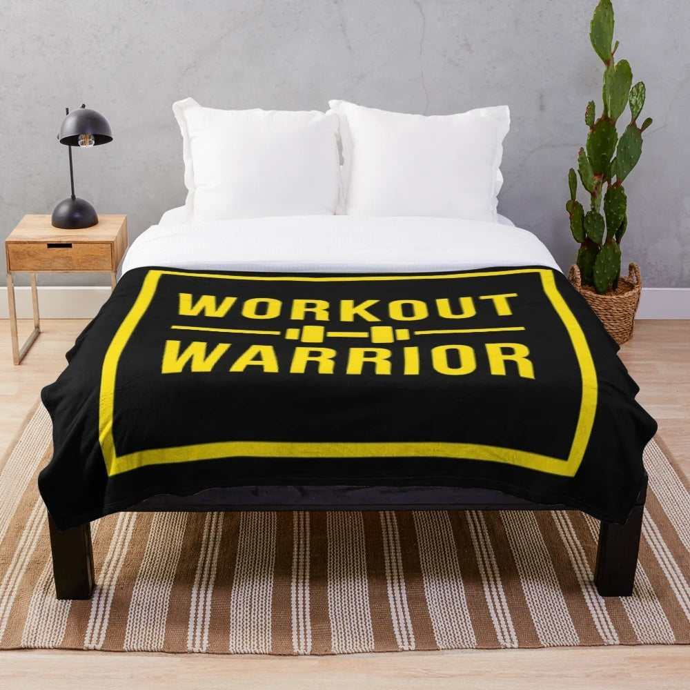 Warrior-inspired plush blanket with gold and black design