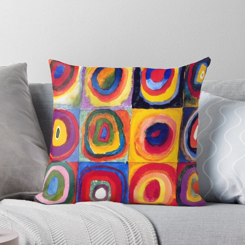 Vibrant abstract art pillow featuring the signature circular and geometric style of renowned Russian artist Wassily Kandinsky.