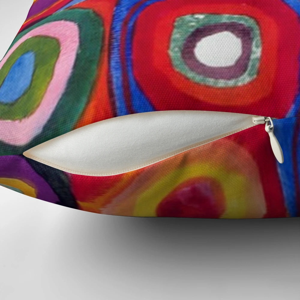 Vibrant abstract art pillow featuring the signature circular and geometric style of renowned Russian artist Wassily Kandinsky.