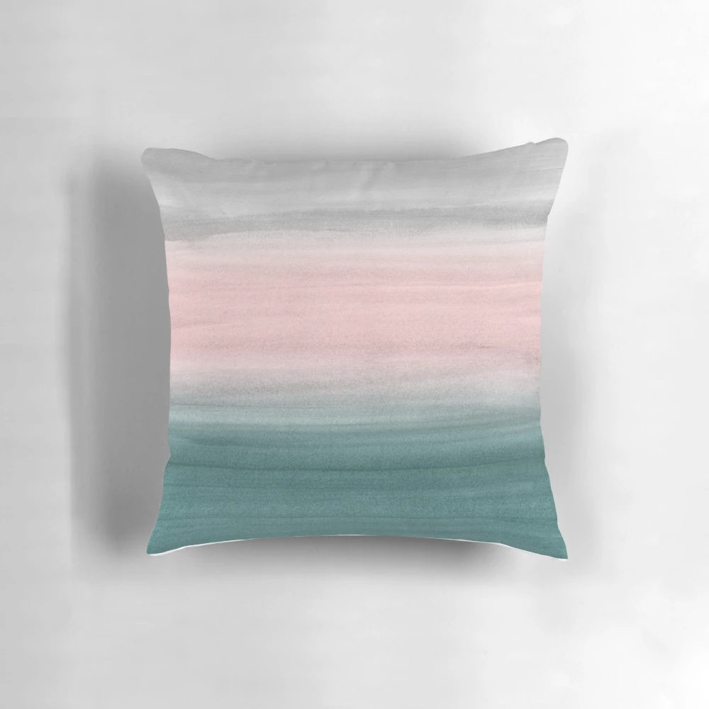 Watercolor abstract art pillow with flowing, ombre colors in teal, gray, and blush