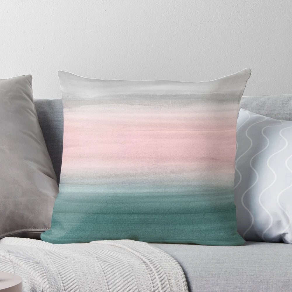 Watercolor abstract art pillow with flowing, ombre colors in teal, gray, and blush