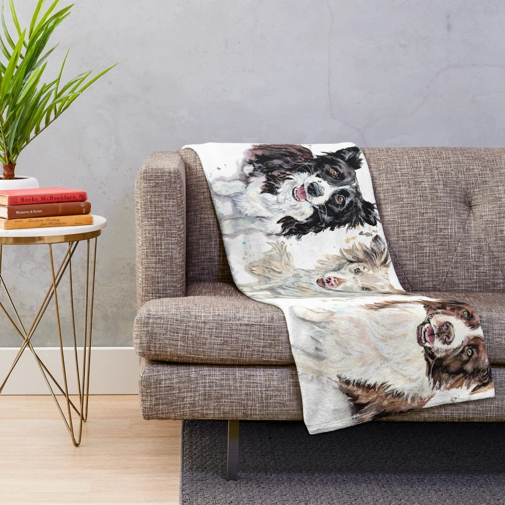 Watercolor painting of border collies on a plush blanket