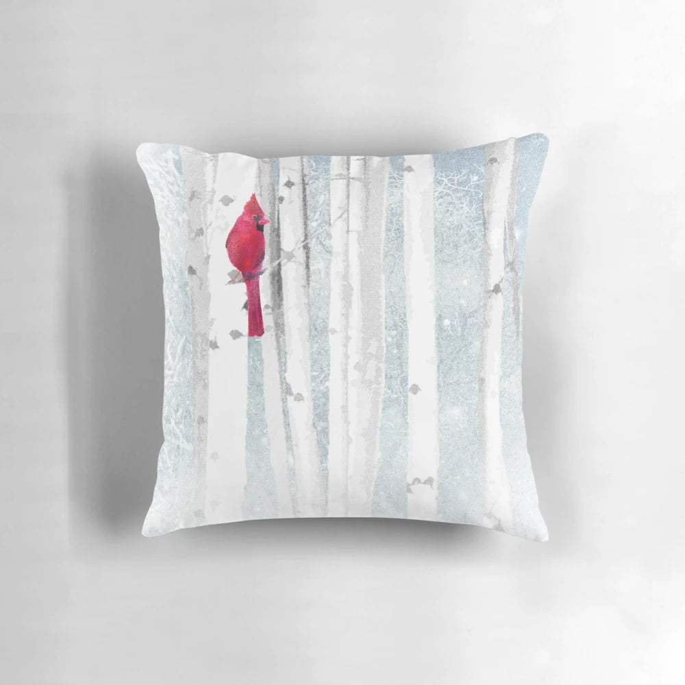 Watercolor painting of a vibrant red cardinal bird perched in a snowy birch tree forest scene.