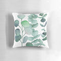 Watercolor painting of green eucalyptus leaves on a decorative cushion for home decor