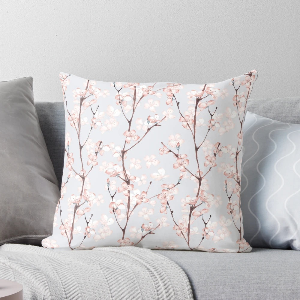 A Pillow showcasing a watercolor floral blossom seamless pattern.