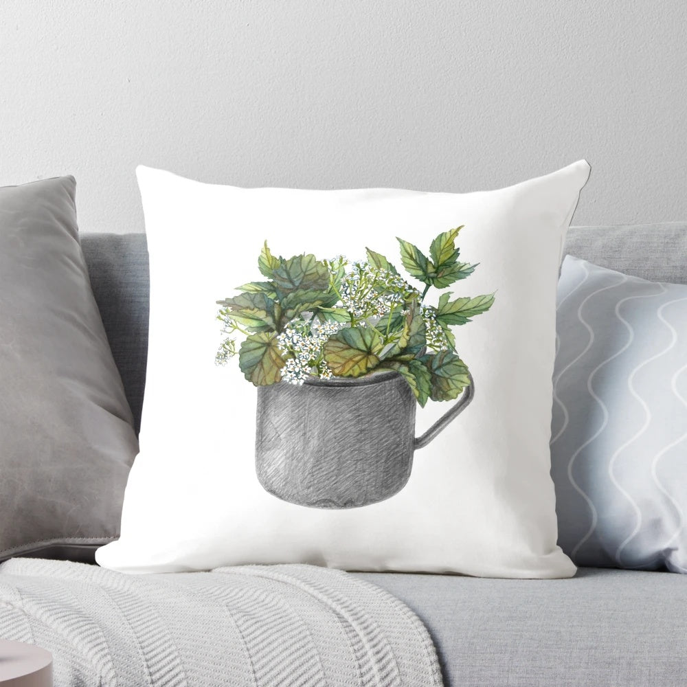 Decorative throw pillow with a watercolor painting of a green forest and wild white flowers