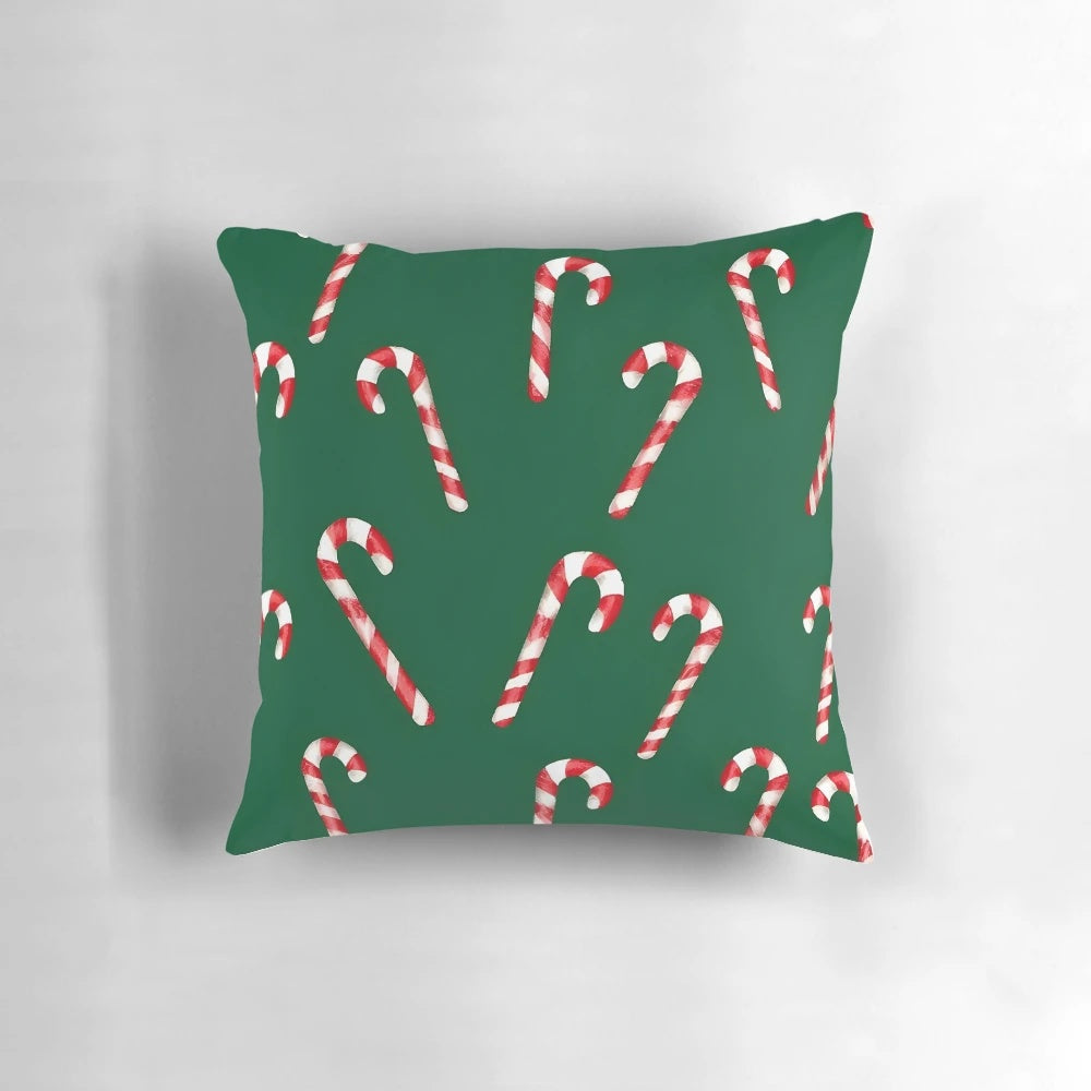 Watercolor green and white candy cane pattern pillow with a cozy, festive design for the holidays.