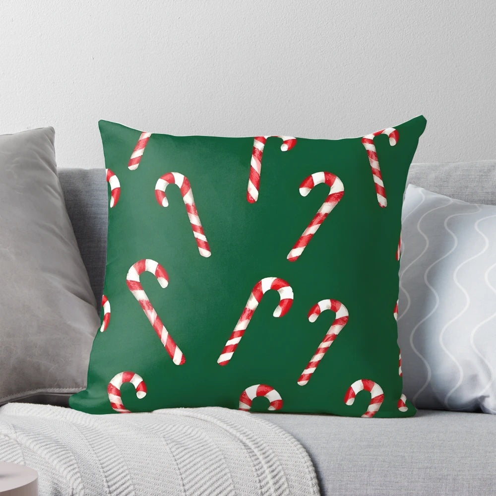 Watercolor green and white candy cane pattern pillow with a cozy, festive design for the holidays.