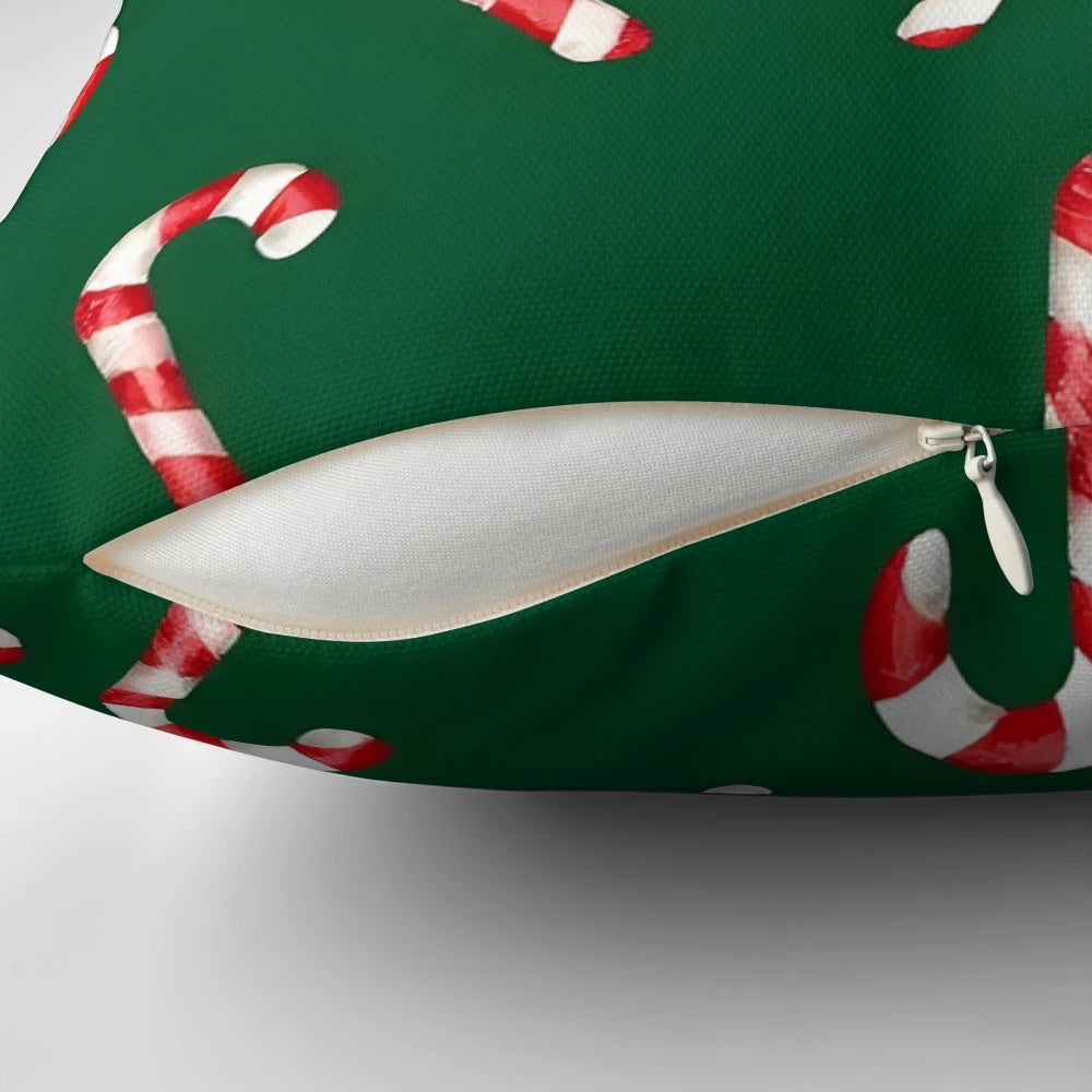 Watercolor green and white candy cane pattern pillow with a cozy, festive design for the holidays.