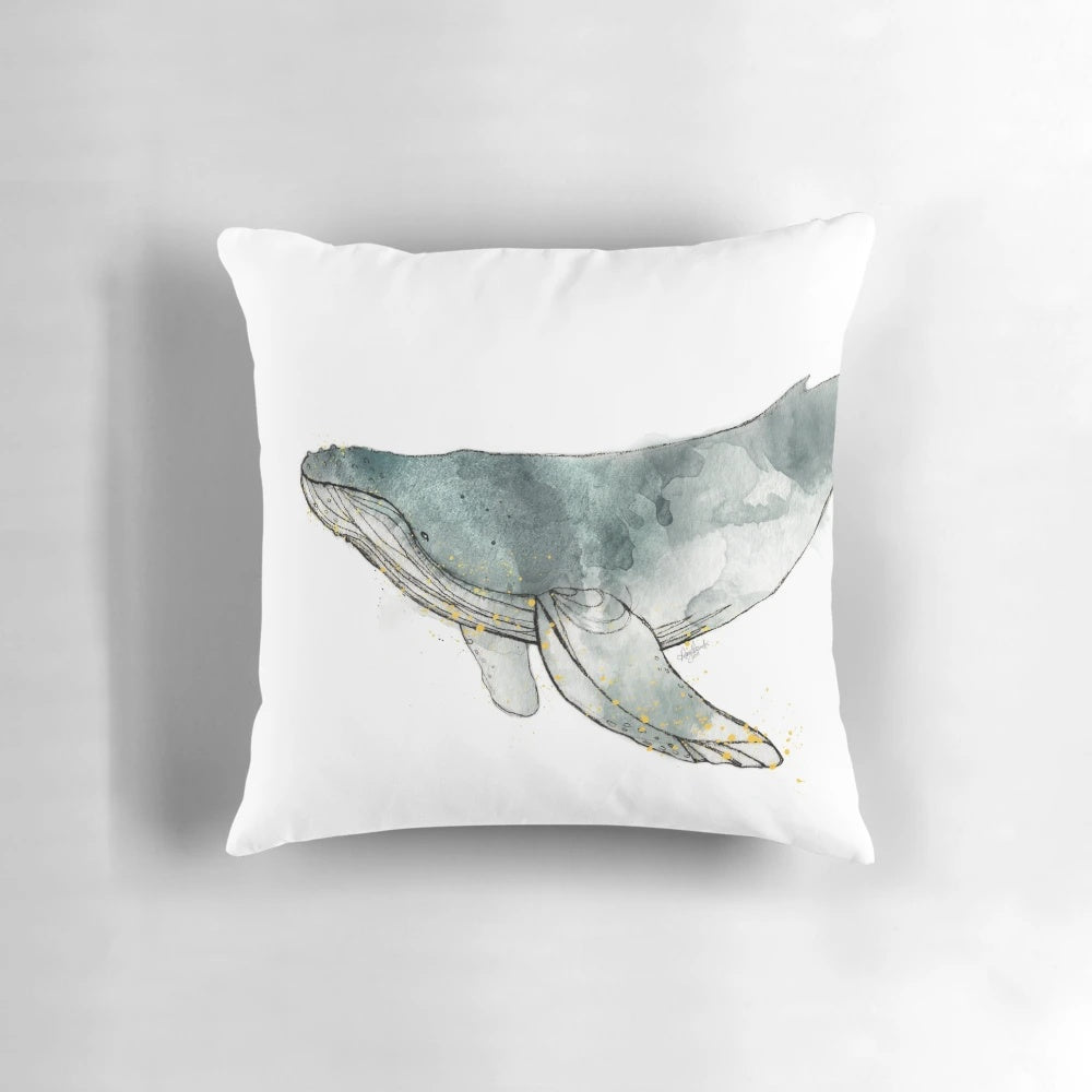 Realistic watercolor illustration of a majestic humpback whale on a cozy throw pillow.