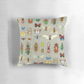 Watercolor illustration of various insects including butterflies, dragonflies, and beetles on a gray background, featured on a decorative pillow.