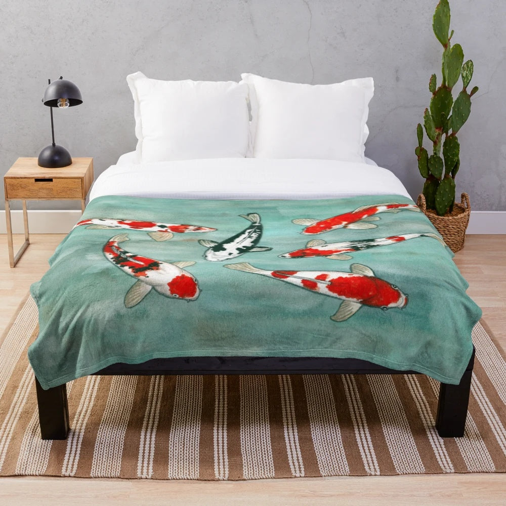 Watercolor koi fish artwork on a plush blanket for cozy aquatic-inspired home decor