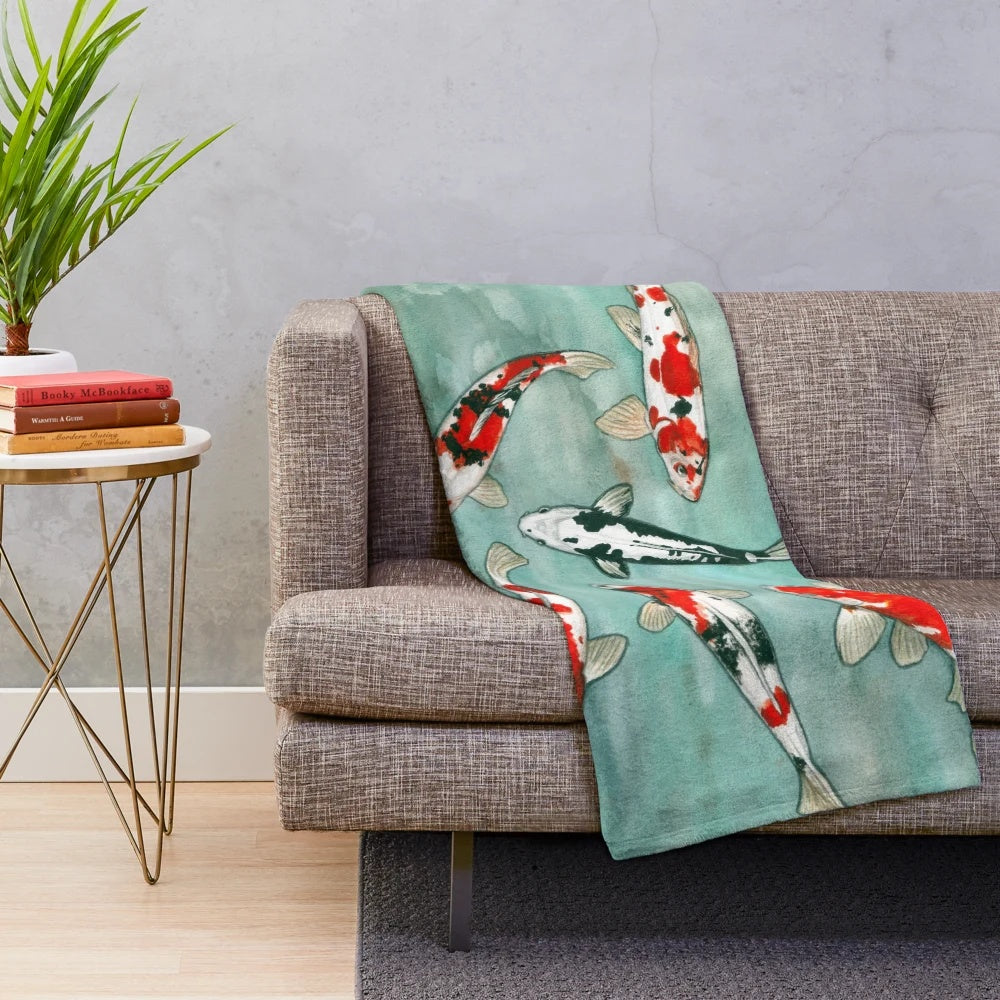 Watercolor koi fish artwork on a plush blanket for cozy aquatic-inspired home decor