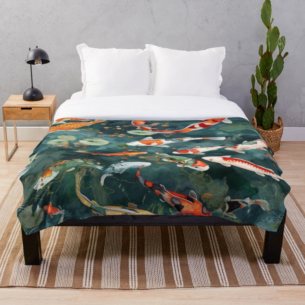 Watercolor koi fish pond design on a plush blanket