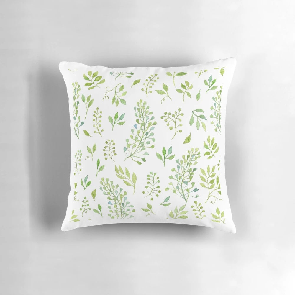 Watercolor leaves pattern throw pillow featuring a hand-drawn design of branches and leaves in a seamless, natural background.