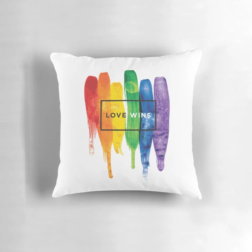 Watercolor LGBTQ love wins rainbow paint typographic design on a soft, plush pillow