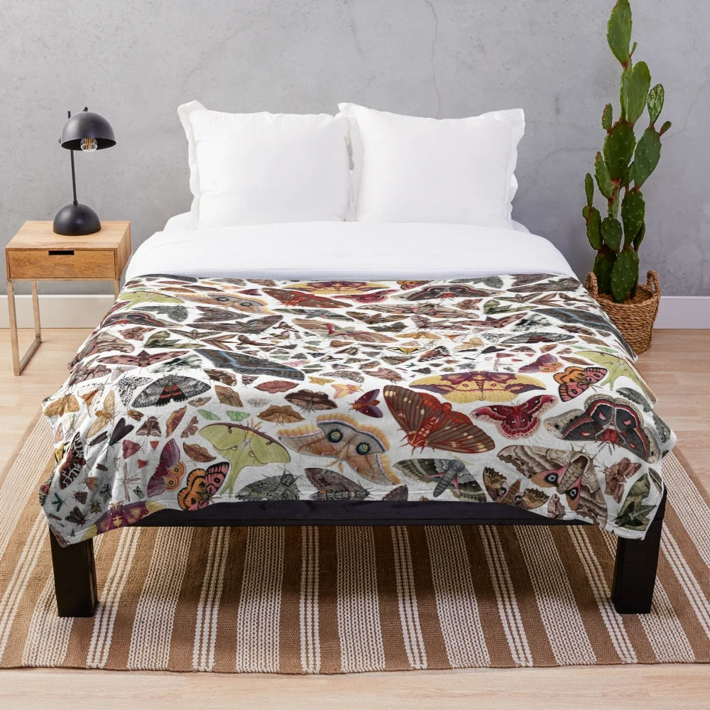 Watercolor moths of North America pattern on a plush blanket