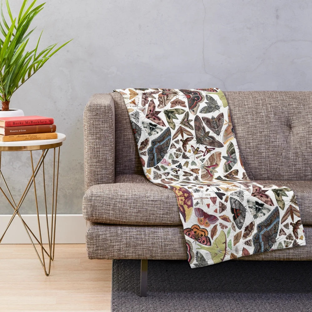 Watercolor moths of North America pattern on a plush blanket
