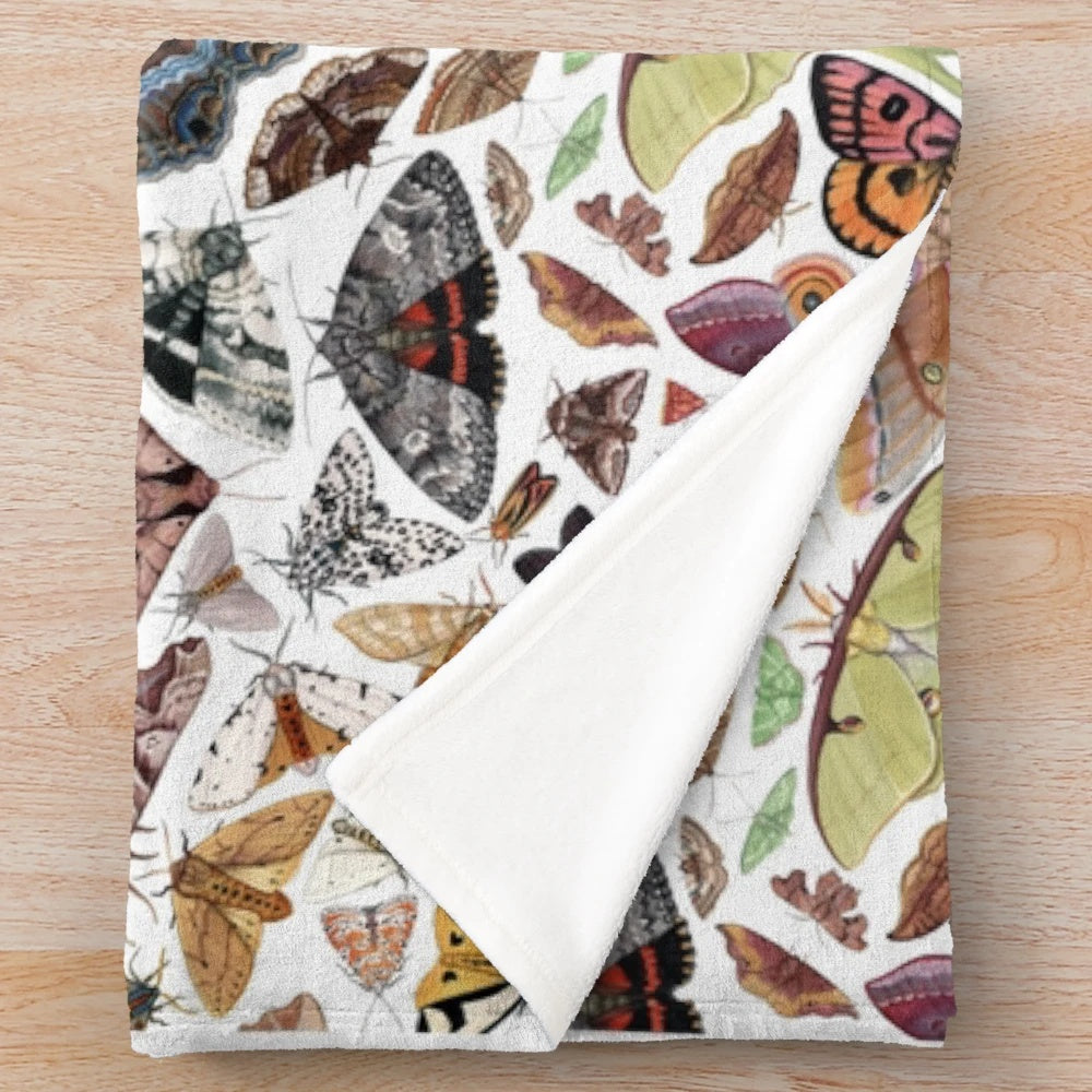 Watercolor moths of North America pattern on a plush blanket