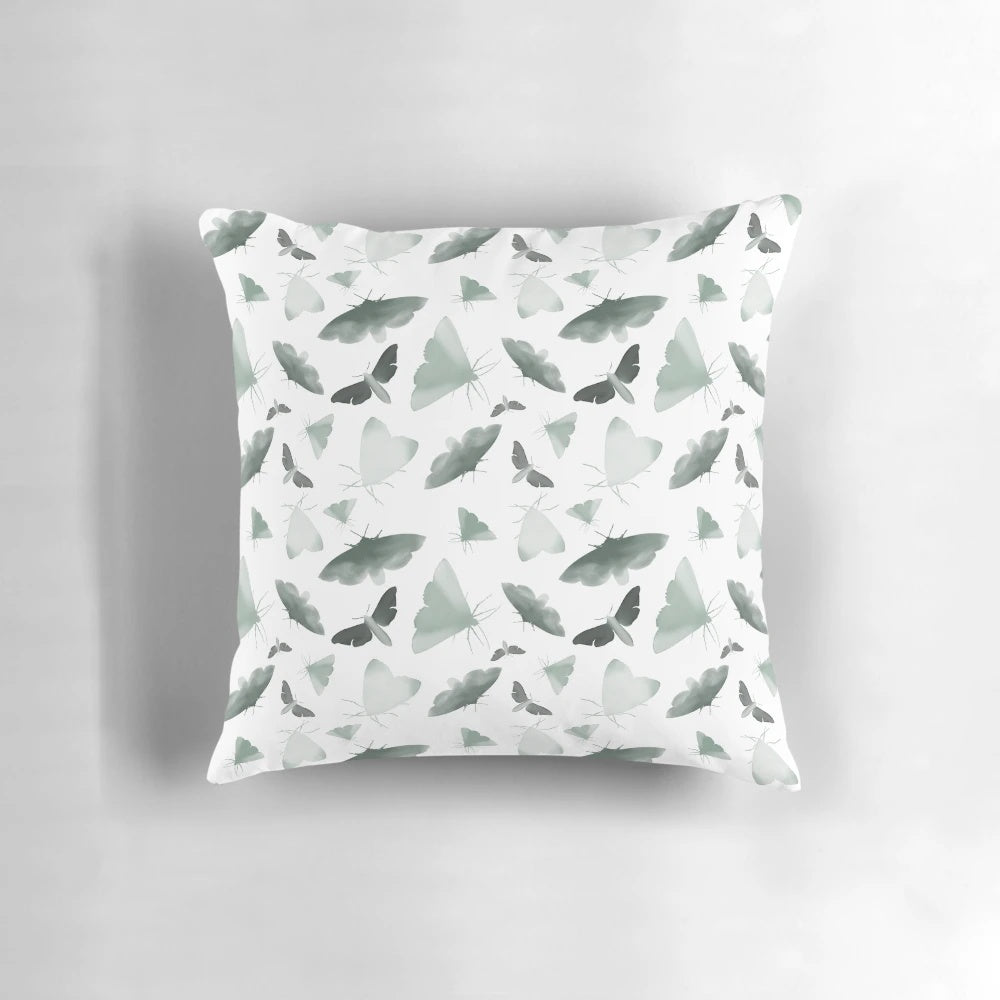 Beautifully designed watercolor moths pillow featuring a pattern of faded, obscure moths and butterflies in a nature-inspired design.