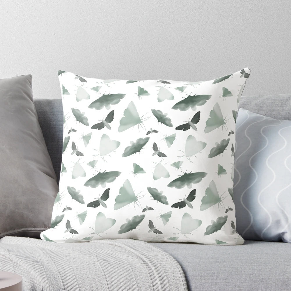 Beautifully designed watercolor moths pillow featuring a pattern of faded, obscure moths and butterflies in a nature-inspired design.
