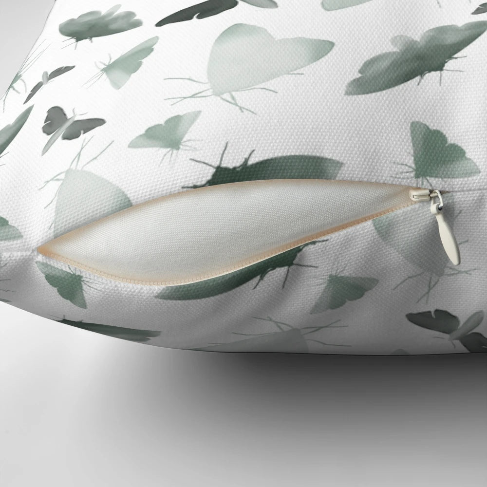 Beautifully designed watercolor moths pillow featuring a pattern of faded, obscure moths and butterflies in a nature-inspired design.