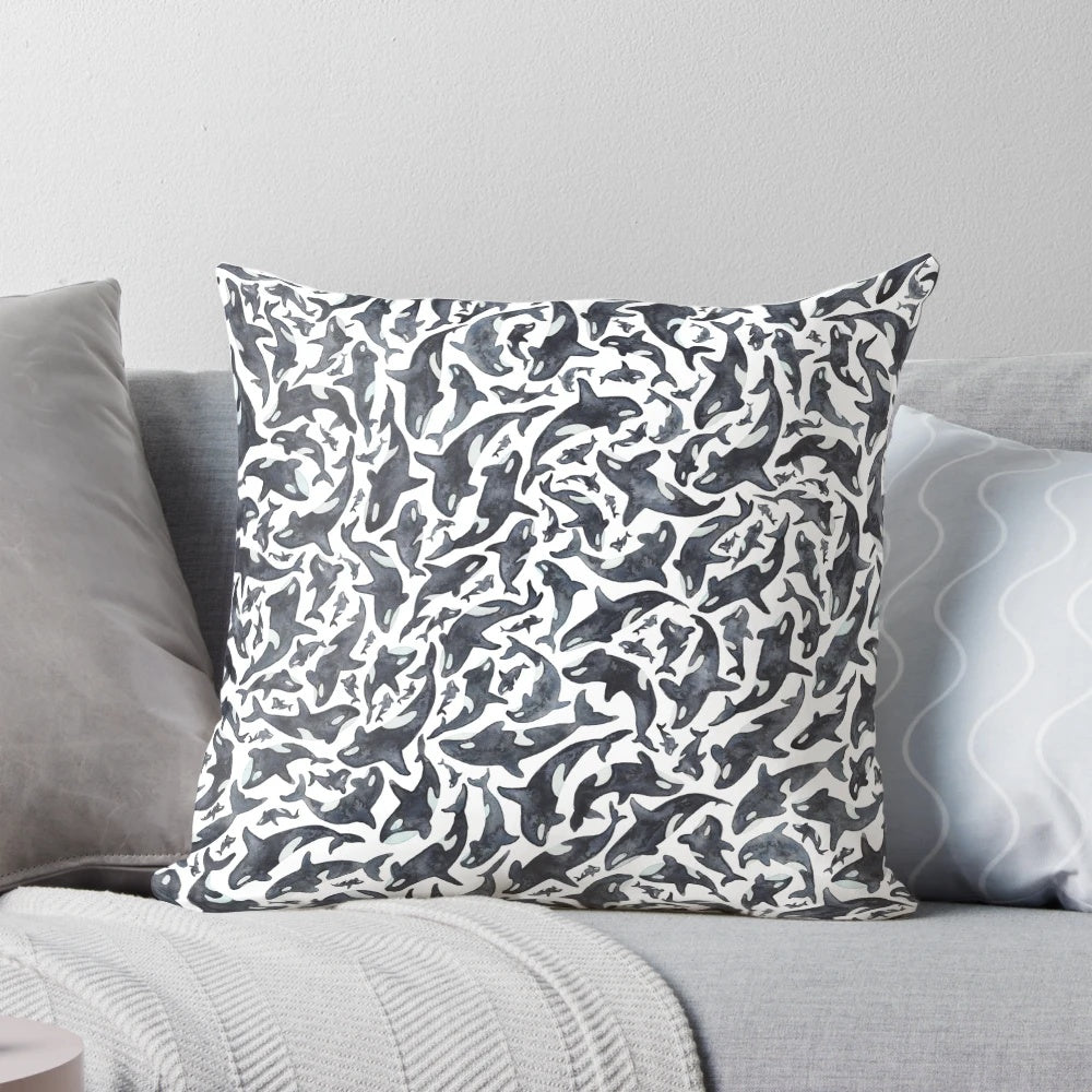 Watercolor illustration of an orca or killer whale on a throw pillow