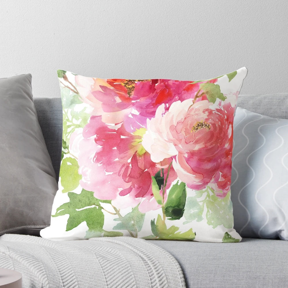 A beautiful watercolor painting of pink peonies on a soft throw pillow for romantic home decor.