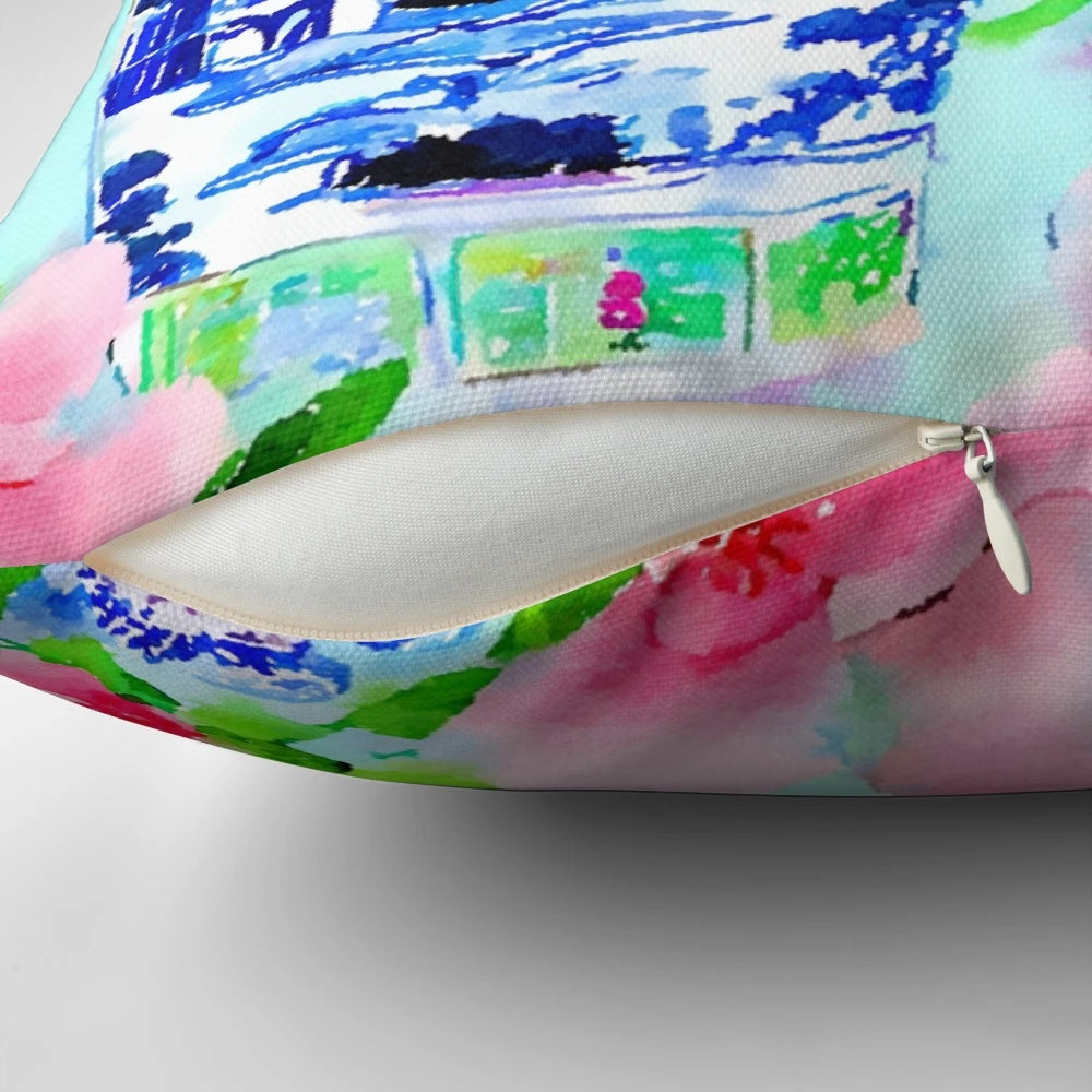 Decorative pillow featuring a watercolor painting of peonies and blue and white chinoiserie ginger jars.