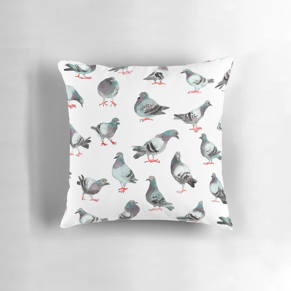 A pillow featuring a watercolor pattern of cute pigeons