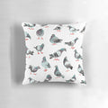 A pillow featuring a watercolor pattern of cute pigeons