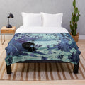 Watercolor-inspired plush blanket with forest landscape, woodland creatures, and tea