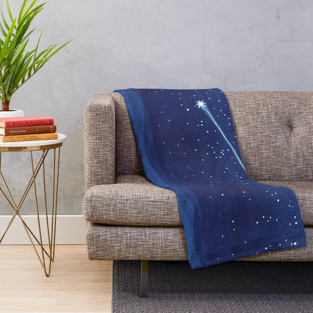 Watercolor-style plush blanket featuring a sailboat on a night sea with shooting stars