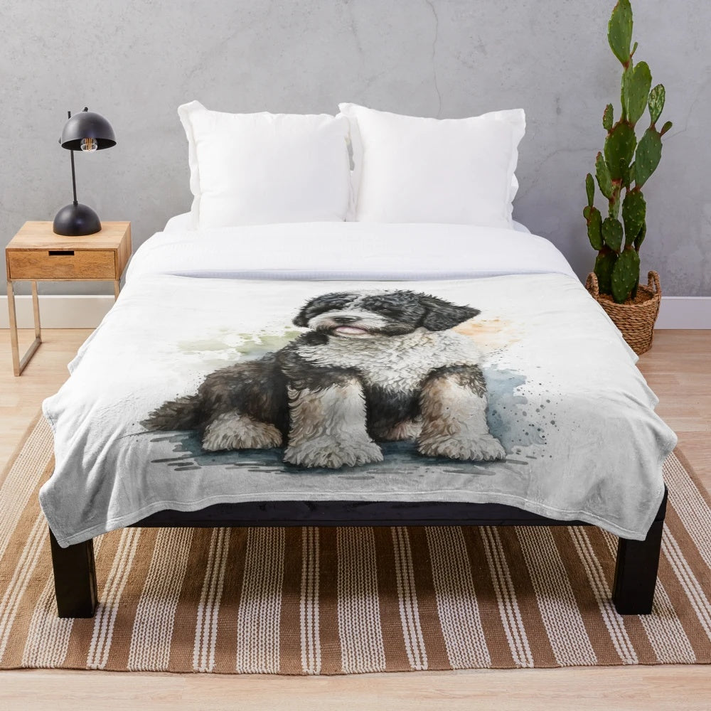 Watercolor painting of a Portuguese water dog on a plush blanket