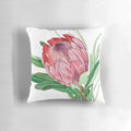Watercolor painting of a vibrant protea flower on a decorative pillow.