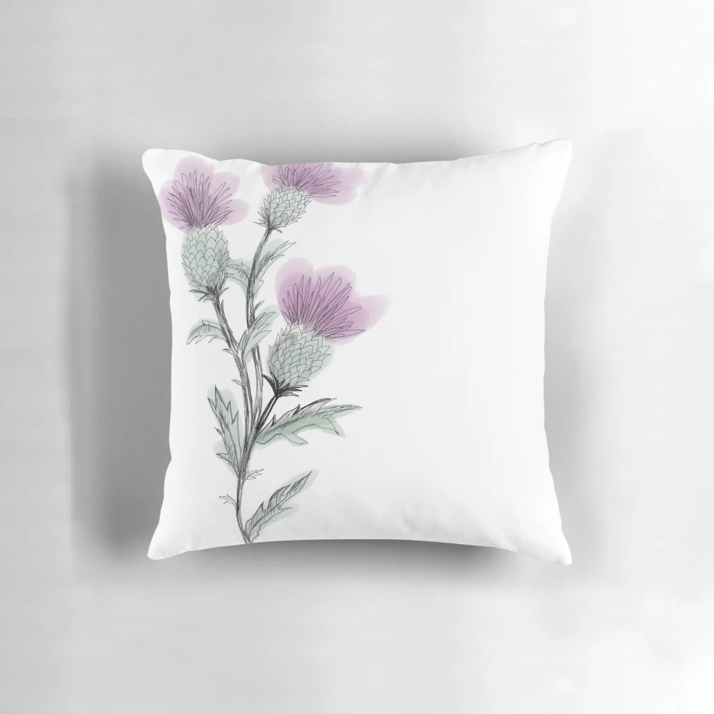 Watercolor painting of a Scottish thistle flower on a decorative throw pillow