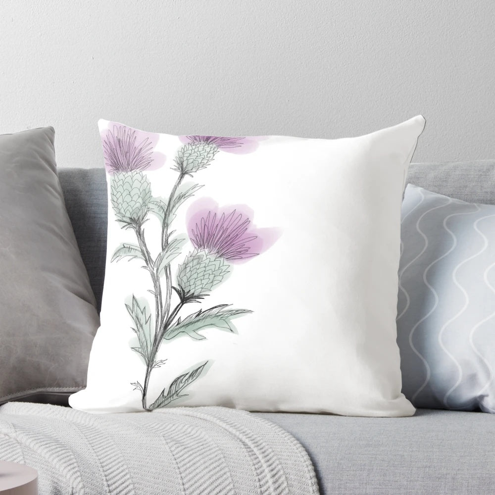Watercolor painting of a Scottish thistle flower on a decorative throw pillow