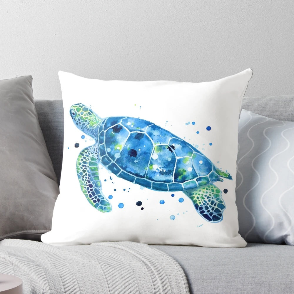 Vibrant watercolor image of a sea turtle on a plush, coastal-inspired pillow.