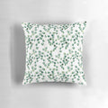 Soft, watercolor-inspired silver dollar eucalyptus pattern on a plush pillow.