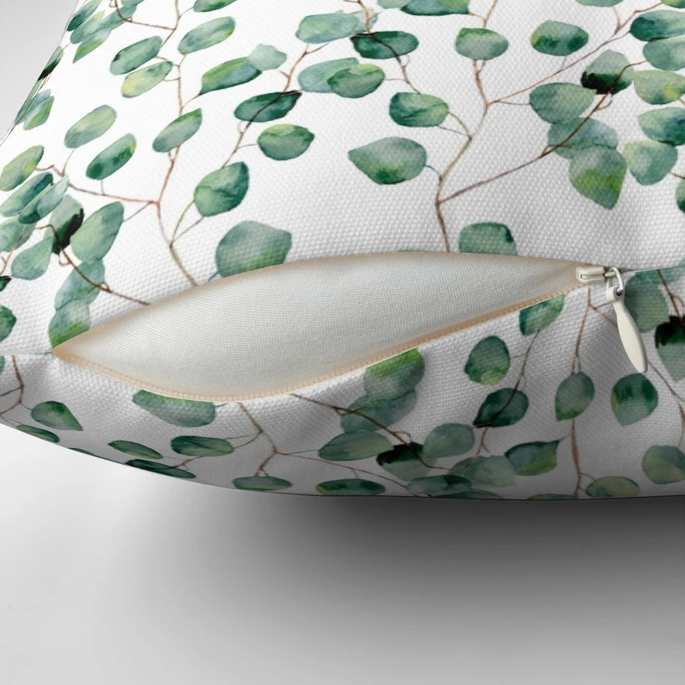 Soft, watercolor-inspired silver dollar eucalyptus pattern on a plush pillow.