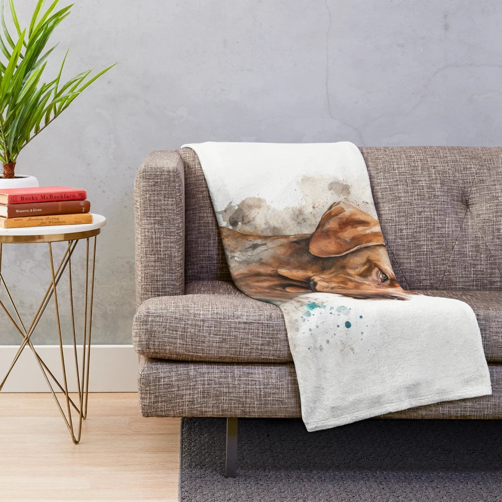 Watercolor sketch of a happy Hungarian Vizsla dog on a plush blanket